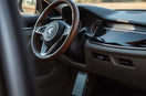 Modern car interior featuring premium comfort and convenience accessories like a steering wheel cover and floor mats