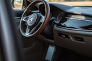 Modern car interior featuring premium comfort and convenience accessories like a steering wheel cover and floor mats