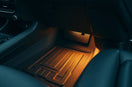 Modern car interior with custom accessories like trim accents, mats, and a phone mount