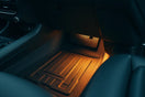 Modern car interior with custom accessories like trim accents, mats, and a phone mount