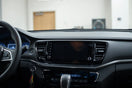 Modern car dashboard electronics with an infotainment screen and visible connectors for reliable upgrades