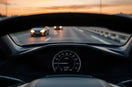 Glowing GPS speedometer display on a modern car dashboard
