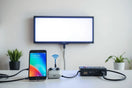 Phone wirelessly controlling a glowing LED display with neatly connected cables