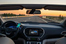 Modern car dashboard with smartphone mount, wireless charging, and ambient lighting