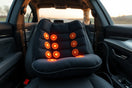 Heated car massage cushion on a car seat with subtle warmth and visible massage nodes