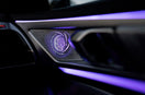 a close up of a car dashboard with a blue light