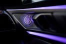 a close up of a car dashboard with a blue light