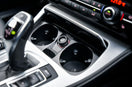 a close up of a car dashboard with a steering wheel