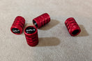 A group of red grips sitting on top of a carpet