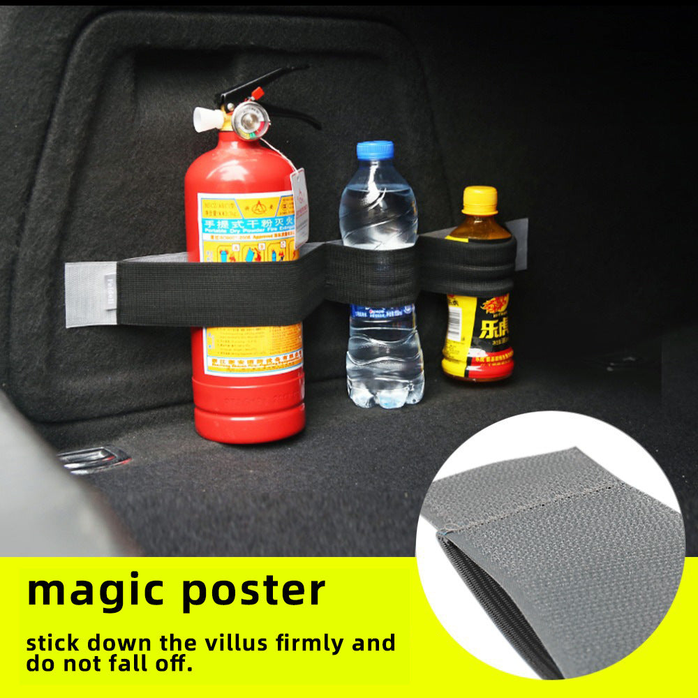 Here is a short, clear, and descriptive alt tag for the image:

A fire extinguisher, two water bottles, and an energy drink are secured to the interior of a vehicle with a hook-and-loop strap.
